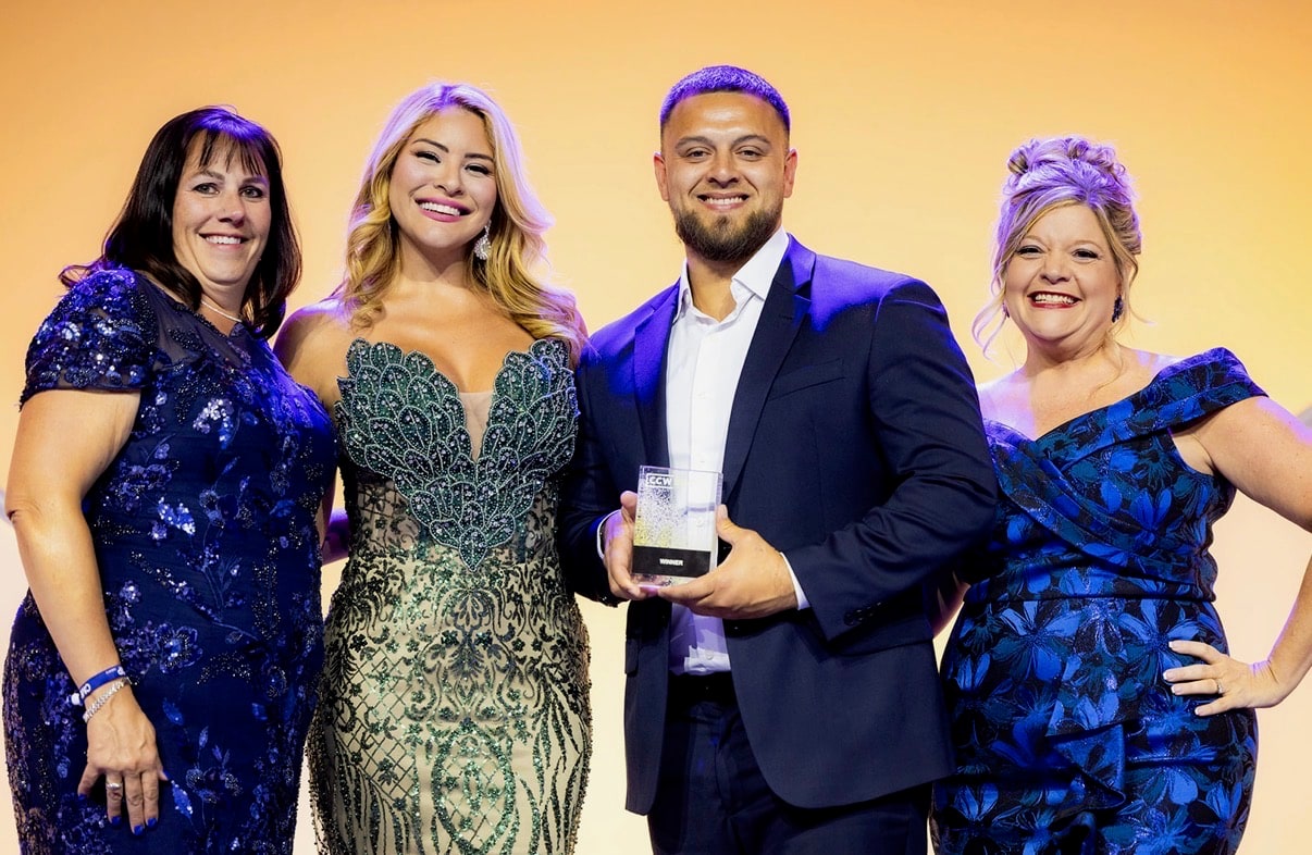 The AmplifAI team accepting the Automation Solution of the Year award at the 2026 CCW Excellence Awards in Las Vegas